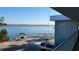 Water view from the second story balcony with swing on the beach at 5055 N Beach Rd # 203, Englewood, FL 34223