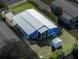 Overhead view of blue house in neighborhood shows the roof, yard and surrounding neighborhood at 6347 Oriole Blvd, Englewood, FL 34224