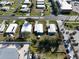 Aerial neighborhood view highlights the home's street location near shopping and other homes at 6347 Oriole Blvd, Englewood, FL 34224