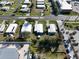 Overhead aerial shot shows the white roof and street view of the home for sale at 6347 Oriole Blvd, Englewood, FL 34224