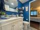 Bathroom featuring stylish floors, vanity sink, natural light and shelving at 6347 Oriole Blvd, Englewood, FL 34224
