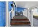 Cozy front porch with seating, ideal for relaxing and enjoying the neighborhood views at 6347 Oriole Blvd, Englewood, FL 34224