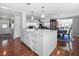 Spacious kitchen area with a large island, pendant lighting, and an open concept design at 6347 Oriole Blvd, Englewood, FL 34224