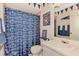 Bathroom with Penn State decor, a toilet, and a single sink vanity, adding personality to the space at 6522 Coliseum Blvd, Port Charlotte, FL 33981