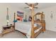 Cozy bedroom with a four-poster bed, neutral walls, and carpet flooring, creating a serene retreat at 6522 Coliseum Blvd, Port Charlotte, FL 33981