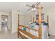 Serene bedroom featuring a wooden four-poster bed, carpeted floors, and a closet at 6522 Coliseum Blvd, Port Charlotte, FL 33981