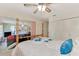 Comfortable bedroom featuring a four-poster bed, closet space, and access to a bright sunroom at 6522 Coliseum Blvd, Port Charlotte, FL 33981