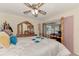 Bright bedroom featuring a wooden four-poster bed, and access to a bright sunroom at 6522 Coliseum Blvd, Port Charlotte, FL 33981