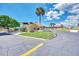 Community clubhouse exterior with mature landscaping and ample parking on a sunny day at 6522 Coliseum Blvd, Port Charlotte, FL 33981