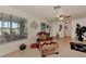 Cozy living room with tile flooring, comfortable seating, and a window with natural light at 6522 Coliseum Blvd, Port Charlotte, FL 33981
