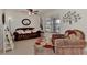Inviting living room with tile flooring, comfortable seating, and view to kitchen dining area at 6522 Coliseum Blvd, Port Charlotte, FL 33981