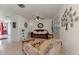 Bright living room with tile floors, comfortable seating, and natural light from the window at 6522 Coliseum Blvd, Port Charlotte, FL 33981