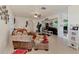 Inviting living room features tile flooring, and view into the Gathering room and hallway at 6522 Coliseum Blvd, Port Charlotte, FL 33981
