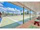 A view of the community shuffleboard courts featuring a covered viewing area and ample lanes at 6522 Coliseum Blvd, Port Charlotte, FL 33981