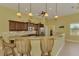 Kitchen island featuring seating space, stainless steel appliances and great lighting at 72 Pennant Ct, Placida, FL 33946