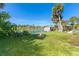 Backyard featuring a fire pit and waterfront views at 8243 Pinetree Ln, Englewood, FL 34224