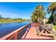 Waterfront view of community pier with a picnic table and bench seating at 8243 Pinetree Ln, Englewood, FL 34224