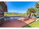 Dock features wood flooring, picnic table, and outdoor seating at 8243 Pinetree Ln, Englewood, FL 34224