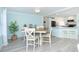 Inviting dining room with a view into the bright kitchen; great for entertaining and everyday living at 8243 Pinetree Ln, Englewood, FL 34224