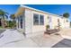 Charming home exterior with decorative stone accents, well-maintained landscaping, and an inviting entrance at 8243 Pinetree Ln, Englewood, FL 34224
