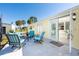 Outdoor patio with comfortable seating, perfect for enjoying the sunny weather and relaxation at 8243 Pinetree Ln, Englewood, FL 34224