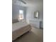 Bright bedroom featuring a neutral color scheme, large windows, and ample space for furniture at 8937 Bantry Bay Blvd, Englewood, FL 34224