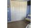Bedroom featuring a closet and chair creating a cozy and functional space for rest and storage at 8937 Bantry Bay Blvd, Englewood, FL 34224
