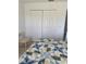 Bedroom featuring a closet, and chair, providing a relaxing and functional space for rest and storage at 8937 Bantry Bay Blvd, Englewood, FL 34224