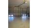 Spacious two car garage with an electric door opener, offering ample space for vehicles and storage at 8937 Bantry Bay Blvd, Englewood, FL 34224