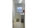 Practical laundry room with washer, dryer, and shelving for efficient storage and organization at 8937 Bantry Bay Blvd, Englewood, FL 34224