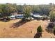Property boasts a single-story ranch-style home with a pool, surrounded by mature trees at 9094 Preston Rd, Brooksville, FL 34601