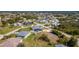 Beautiful aerial view of residential lot in a neighborhood with mature trees and landscaping at 9129 Bensonhurst Ln, Englewood, FL 34224