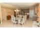 Charming dining room featuring a table for four, stylish decor, and modern cabinetry at 9203 Griggs Rd # 301, Englewood, FL 34224