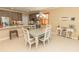 Charming dining room featuring a table for four, stylish decor, and modern cabinetry at 9203 Griggs Rd # 301, Englewood, FL 34224
