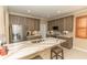 Modern kitchen boasts stainless steel appliances, stone countertops, and ample cabinet space at 9203 Griggs Rd # 301, Englewood, FL 34224