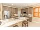 Stylish kitchen island featuring a white countertop, stainless steel appliances, and shaker style cabinets at 9203 Griggs Rd # 301, Englewood, FL 34224