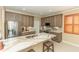 Bright kitchen features stainless steel appliances, an island with marble countertop, and stylish backsplash at 9203 Griggs Rd # 301, Englewood, FL 34224