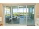 Spacious screened lanai provides water views, comfortable seating, and an outdoor dining area at 9203 Griggs Rd # 301, Englewood, FL 34224
