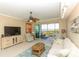 Comfortable living room features neutral decor and large sliding doors to a screened lanai at 9203 Griggs Rd # 301, Englewood, FL 34224