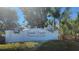 The Grande Preserve on Lemon Bay sign welcomes visitors with lush landscaping and clear signage at 9203 Griggs Rd # 301, Englewood, FL 34224