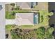 Aerial view of the property, highlighting the pool, lanai, and landscaping at 118 Albatross Rd, Rotonda West, FL 33947