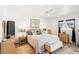 Well-lit main bedroom showcasing light wood floors and a large window at 118 Albatross Rd, Rotonda West, FL 33947