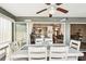 Covered patio dining area with a view into the dining room and living area inside the home at 118 Albatross Rd, Rotonda West, FL 33947