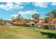 Scenic water view reflecting the surrounding mature trees and blue sky at 118 Albatross Rd, Rotonda West, FL 33947