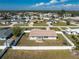 Aerial view of a charming single-story home with a fenced-in yard and view of the neighborhood at 1313 Buereau Rd, Englewood, FL 34223