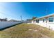 Backyard featuring a new pergola over a patio, providing shade and style at 1313 Buereau Rd, Englewood, FL 34223