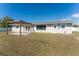 Backyard featuring a new pergola over a patio, providing shade and style at 1313 Buereau Rd, Englewood, FL 34223