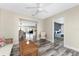 Neutral living room with wood-look flooring leads to dining area and bedroom at 1313 Buereau Rd, Englewood, FL 34223