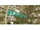 Aerial view of property boundary lines, showcasing land parcel with trees in a residential area at 1320 Bayshore Dr, Englewood, FL 34223