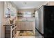 Bright kitchen featuring modern appliances, ample cabinets, and natural light from the adjacent windows at 1320 Bayshore Dr, Englewood, FL 34223